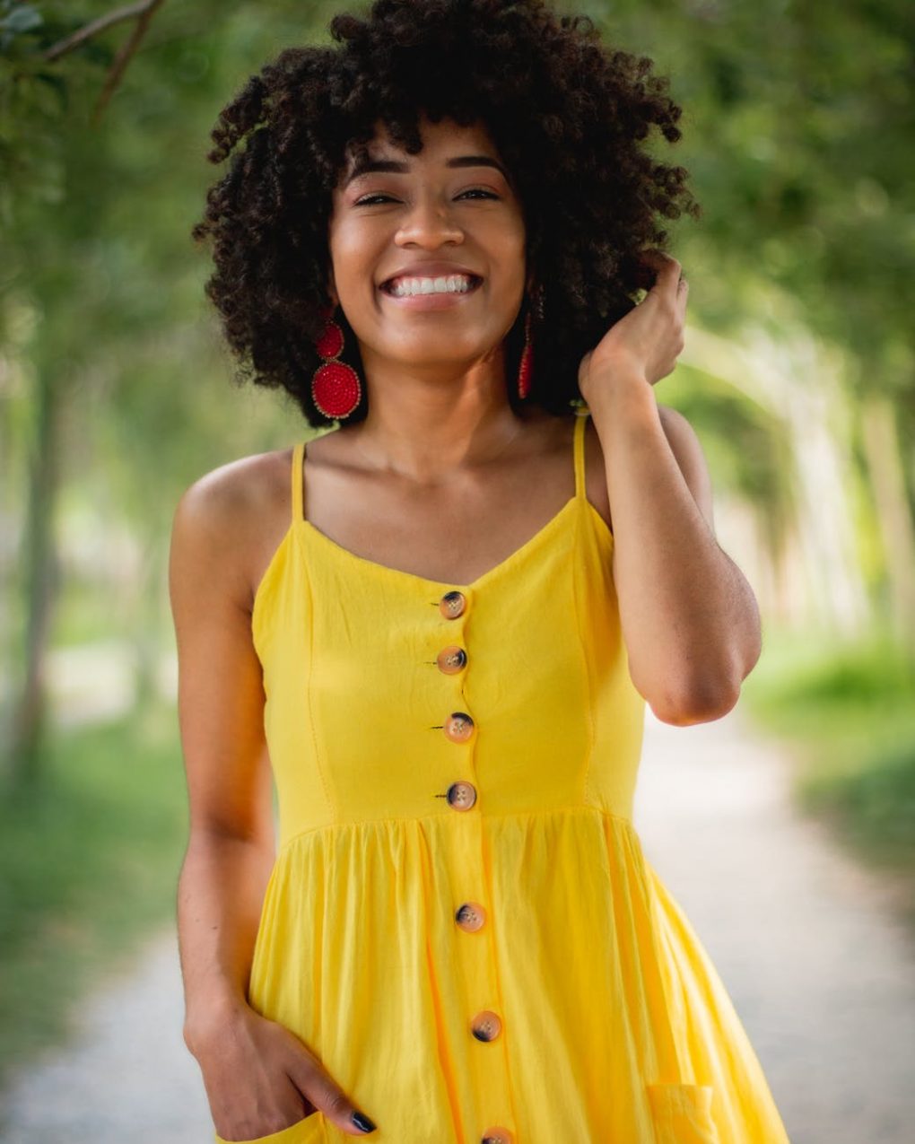 girl with smile in a lemon yellow maxi dress